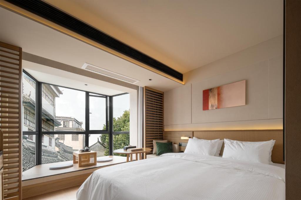Postel nebo postele na pokoji v ubytování Maiyue Hotel-Xi`an Zhonggulou