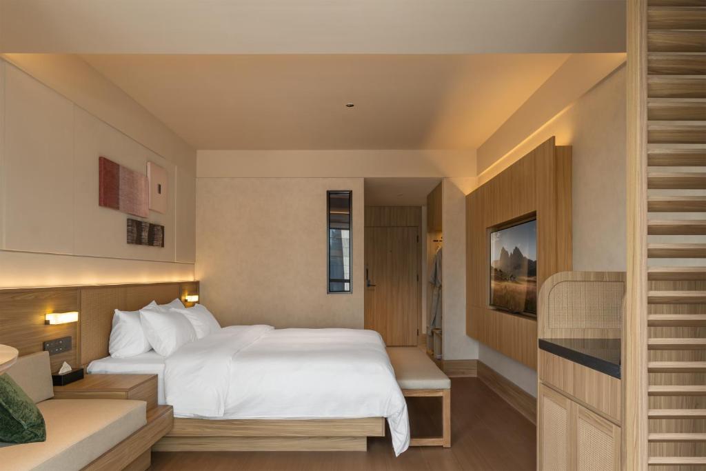 Postel nebo postele na pokoji v ubytování Maiyue Hotel-Xi`an Zhonggulou