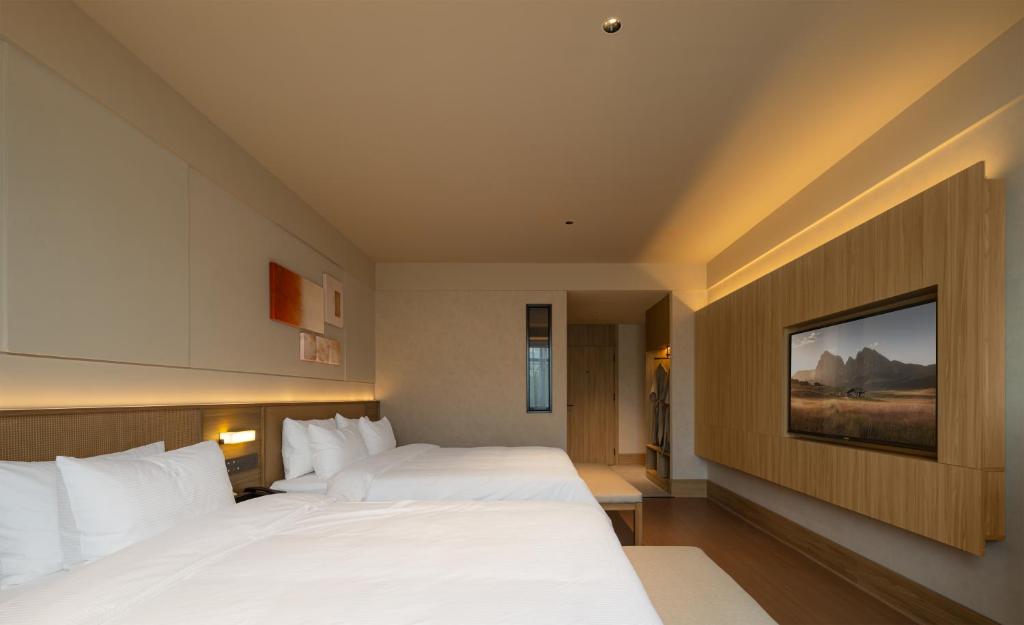Postel nebo postele na pokoji v ubytování Maiyue Hotel-Xi`an Zhonggulou