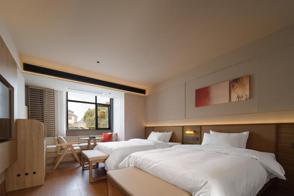 Postel nebo postele na pokoji v ubytování Maiyue Hotel-Xi`an Zhonggulou