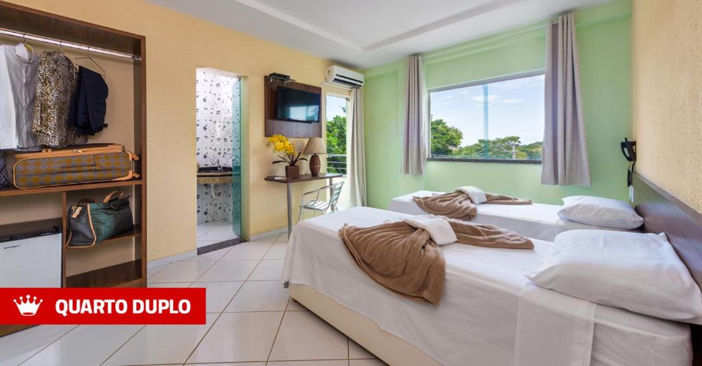 Postel nebo postele na pokoji v ubytování Hotel Imperial