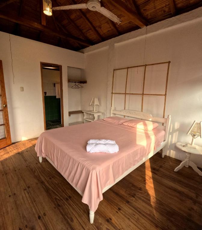 Postel nebo postele na pokoji v ubytování La Perla Hostel and Cabins