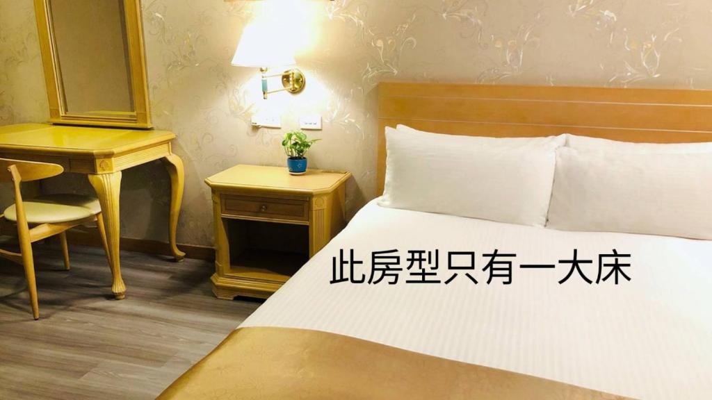 Postel nebo postele na pokoji v ubytování Cambridge Hotel - Yung Kang