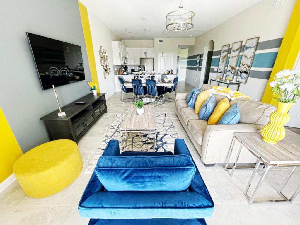 a living room with a couch and a table at Luxury 2bd 2 bath Condo Home 232 in Davenport