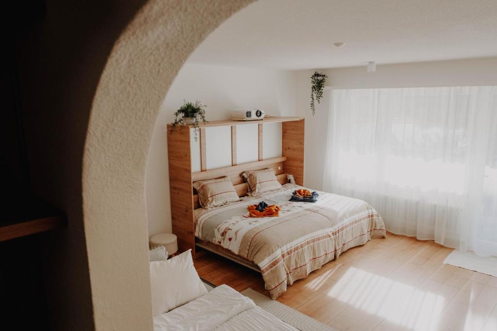 Postel nebo postele na pokoji v ubytování Superb Modern Studio Leukerbad