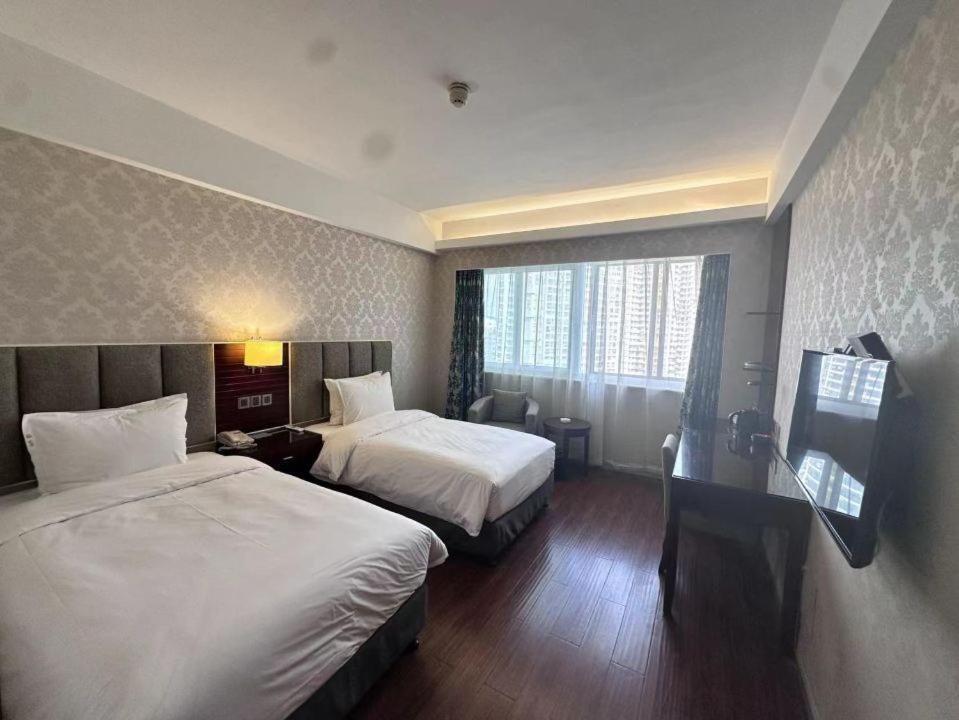 Postel nebo postele na pokoji v ubytování Holiday Inn Express Xiamen Lushan -Shopping Center by IHG