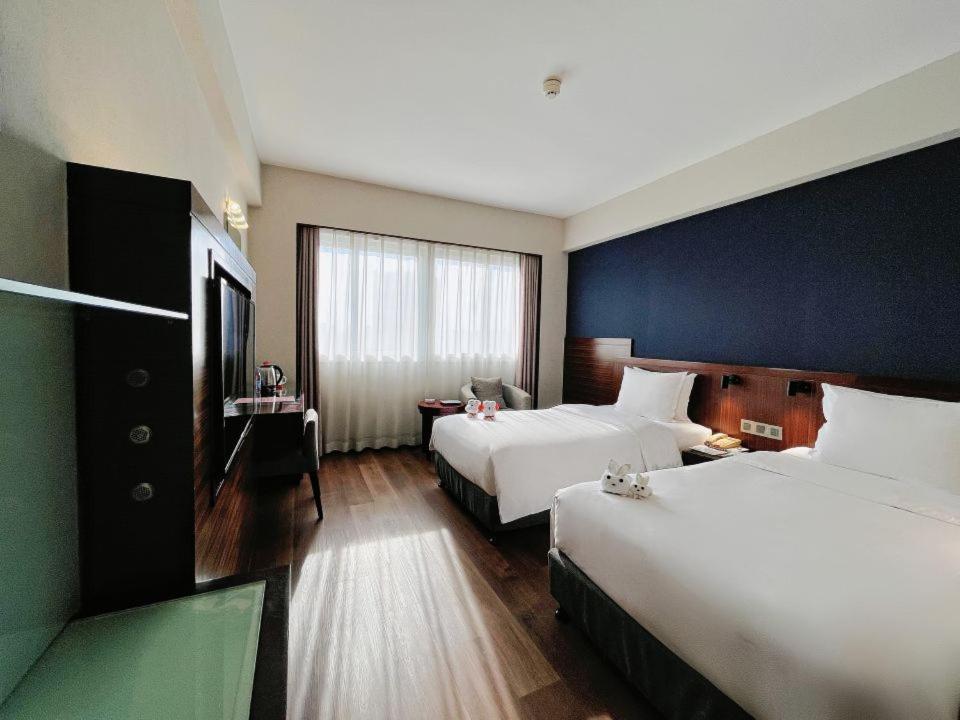 Postel nebo postele na pokoji v ubytování Holiday Inn Express Xiamen Lushan -Shopping Center by IHG