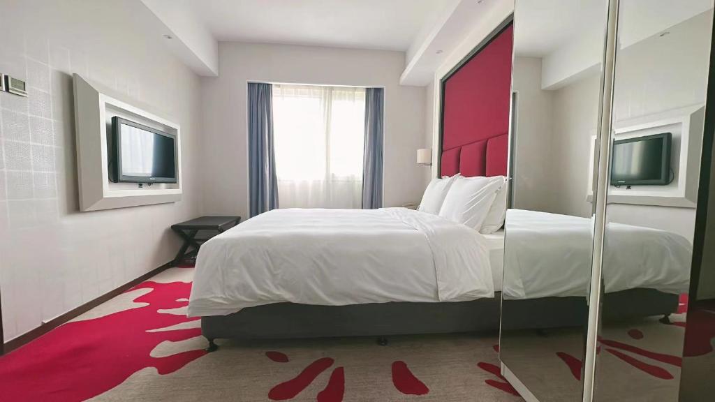 Postel nebo postele na pokoji v ubytování Holiday Inn Express Xiamen Lushan -Shopping Center by IHG