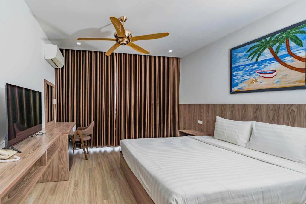 Postel nebo postele na pokoji v ubytování 1 Stop ViVi An Bang Beach Hoi An Hotel