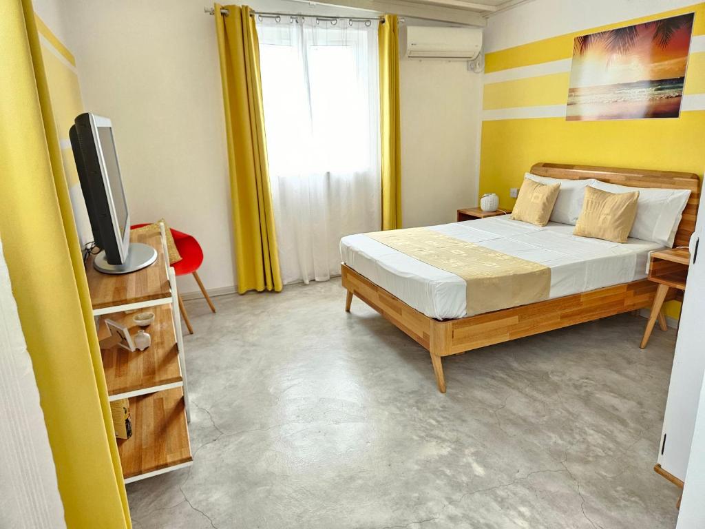 Postel nebo postele na pokoji v ubytování Casa Frangipani Mauritius