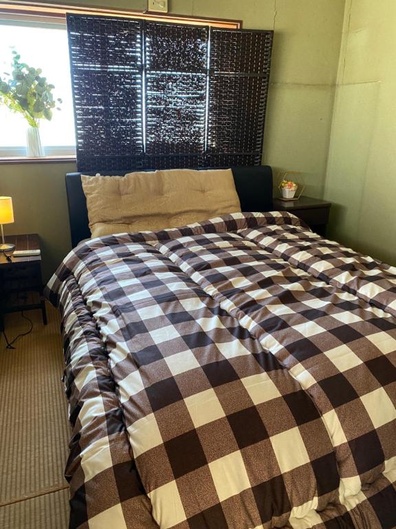 Postel nebo postele na pokoji v ubytování One room Pusang Gala Yuki City