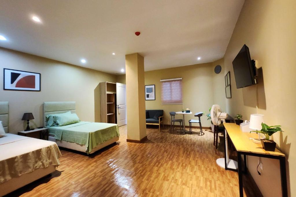 Postel nebo postele na pokoji v ubytování Freddo Studio Apartelle