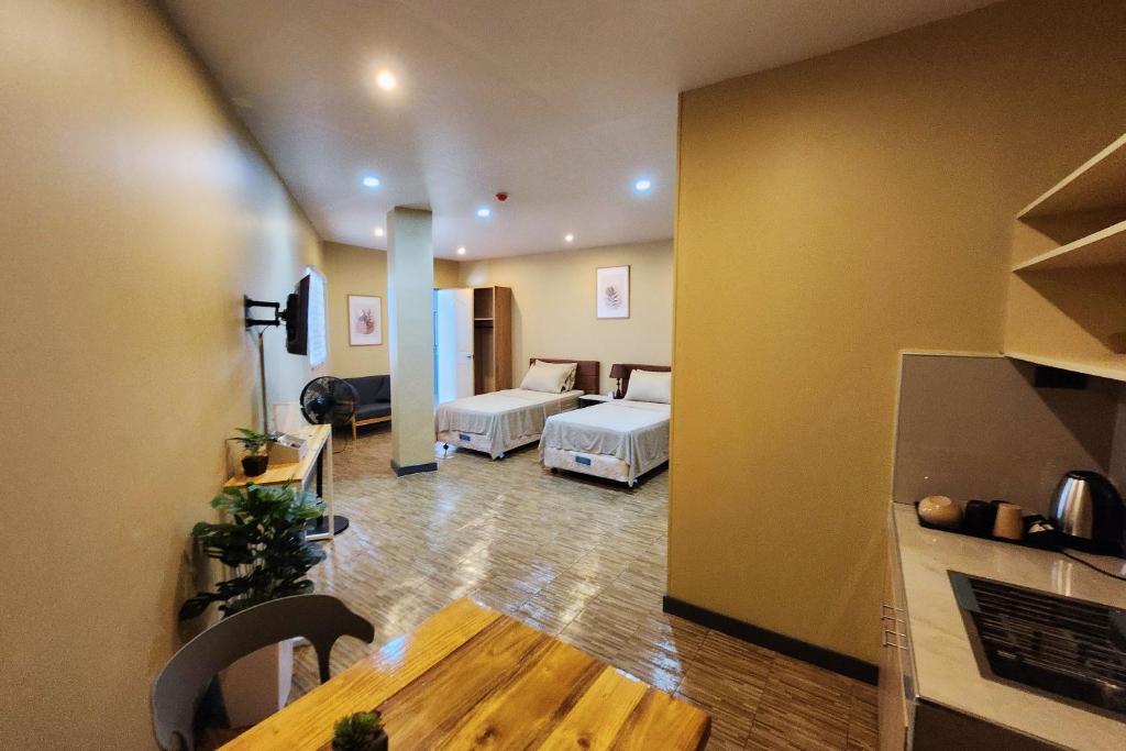 Postel nebo postele na pokoji v ubytování Freddo Studio Apartelle