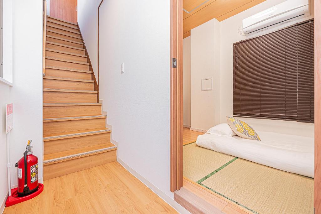 Postel nebo postele na pokoji v ubytování Jone叙園商店街近隣駅徒步5分 新宿12分