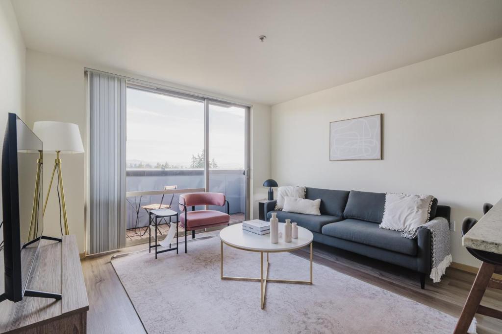 a living room with a couch and a table at Blueground Columbia City gym wd nr parks SEA-786 in Seattle