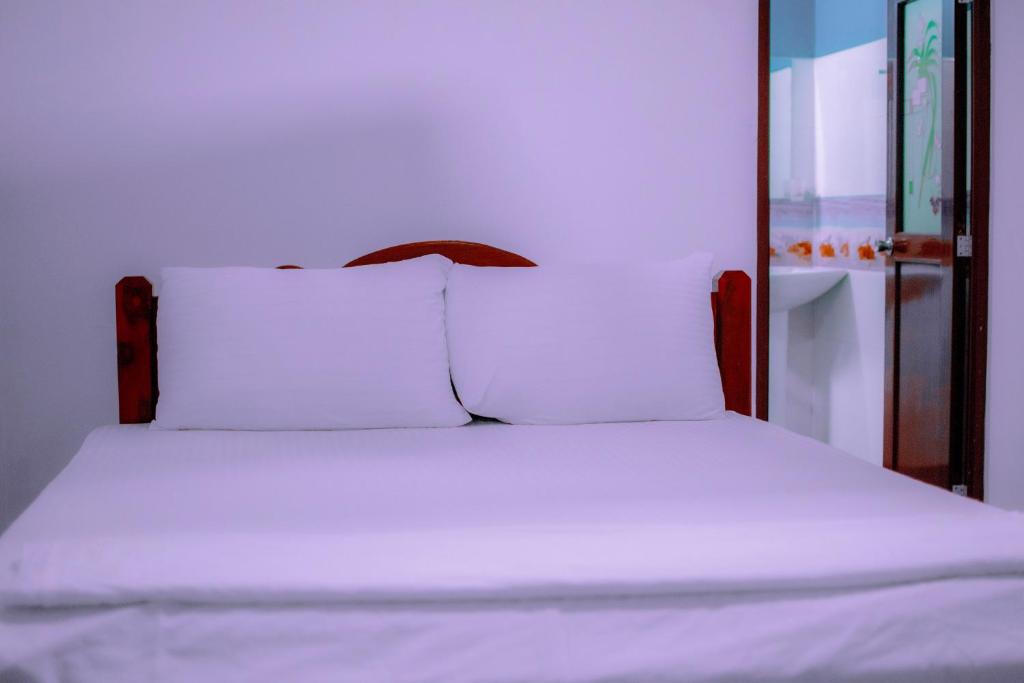 Postel nebo postele na pokoji v ubytování Tourist Holiday Inn