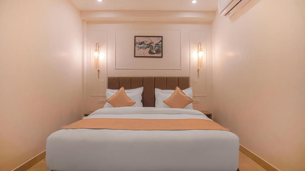 Postel nebo postele na pokoji v ubytování Perfectstayz Premium Varanasi
