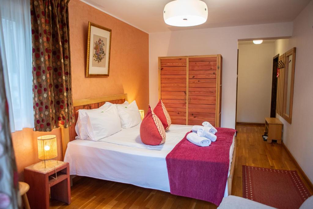 Postel nebo postele na pokoji v ubytování Villa Ermitage