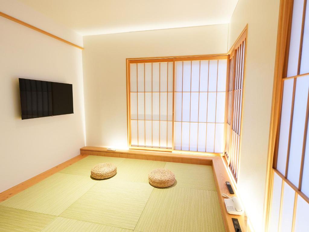 TV a/nebo společenská místnost v ubytování 大日寺の宿 京都吉祥院