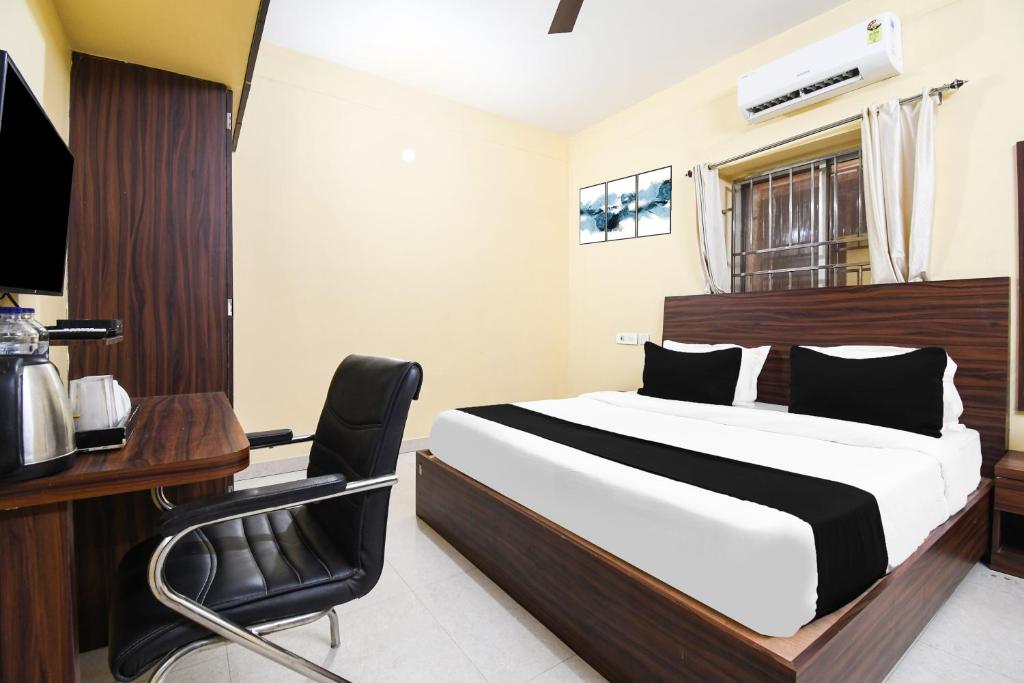 Postel nebo postele na pokoji v ubytování Super Hotel O Indira Park Road Bhubaneswar