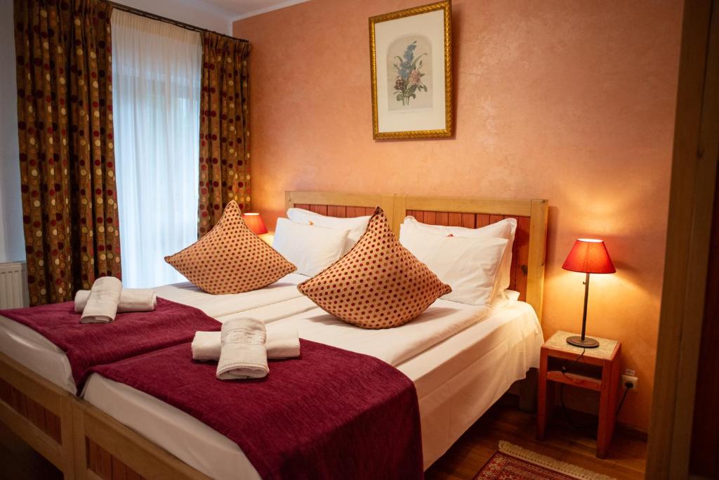 Postel nebo postele na pokoji v ubytování Villa Ermitage