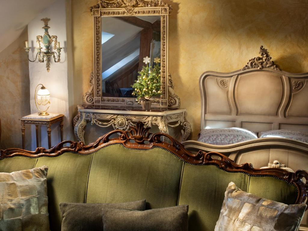 a bedroom with a mirror and a bed with pillows at Lichtenstein LVA Apartmán in Břeclav