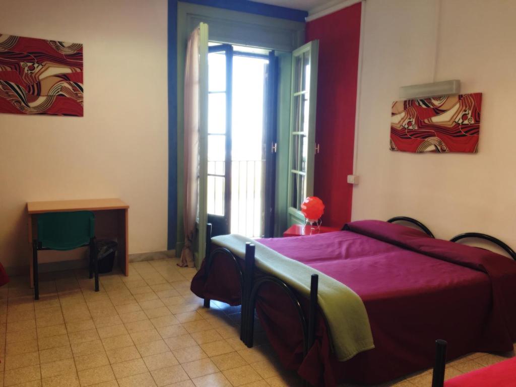 Postel nebo postele na pokoji v ubytování Litus Roma Hostel