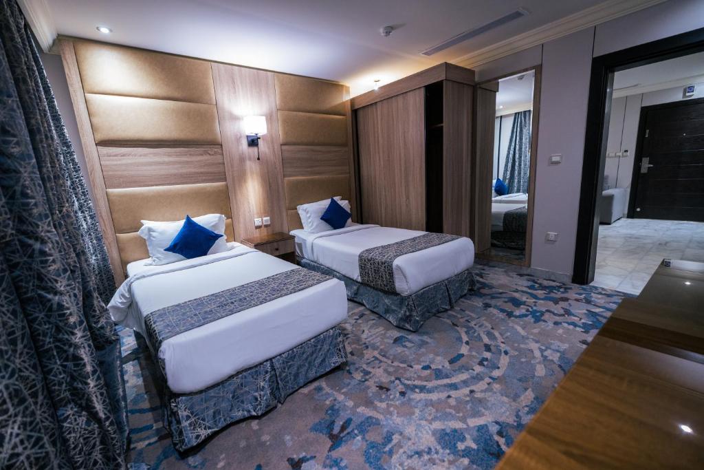 Postel nebo postele na pokoji v ubytování Ebreez Hotel