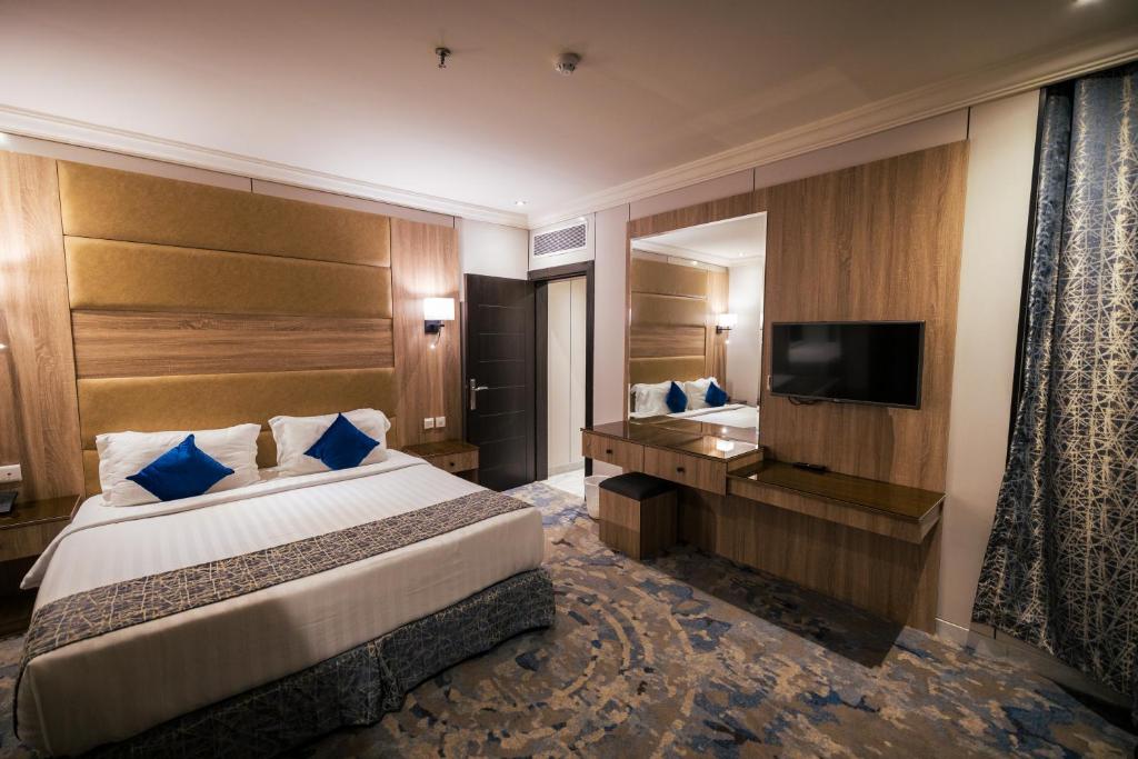 Postel nebo postele na pokoji v ubytování Ebreez Hotel