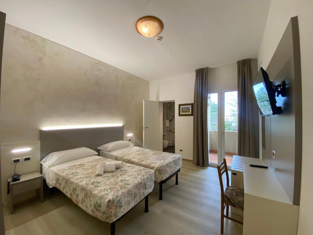 Postel nebo postele na pokoji v ubytování Hotel Lanterna Padova