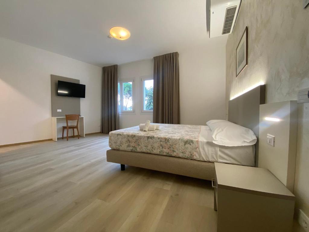 Postel nebo postele na pokoji v ubytování Hotel Lanterna Padova