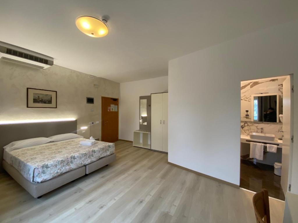 Postel nebo postele na pokoji v ubytování Hotel Lanterna Padova