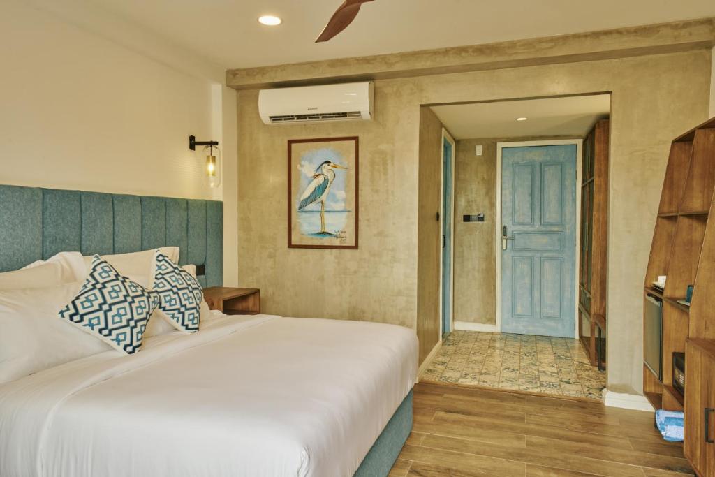 Postel nebo postele na pokoji v ubytování Beach Hotel Dhigurah