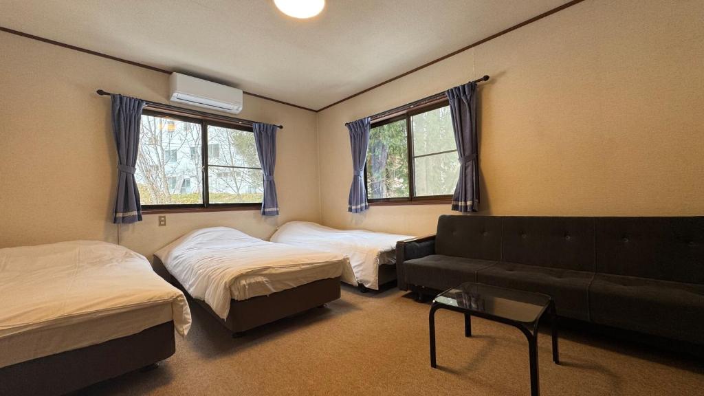 Postel nebo postele na pokoji v ubytování Glide Inn