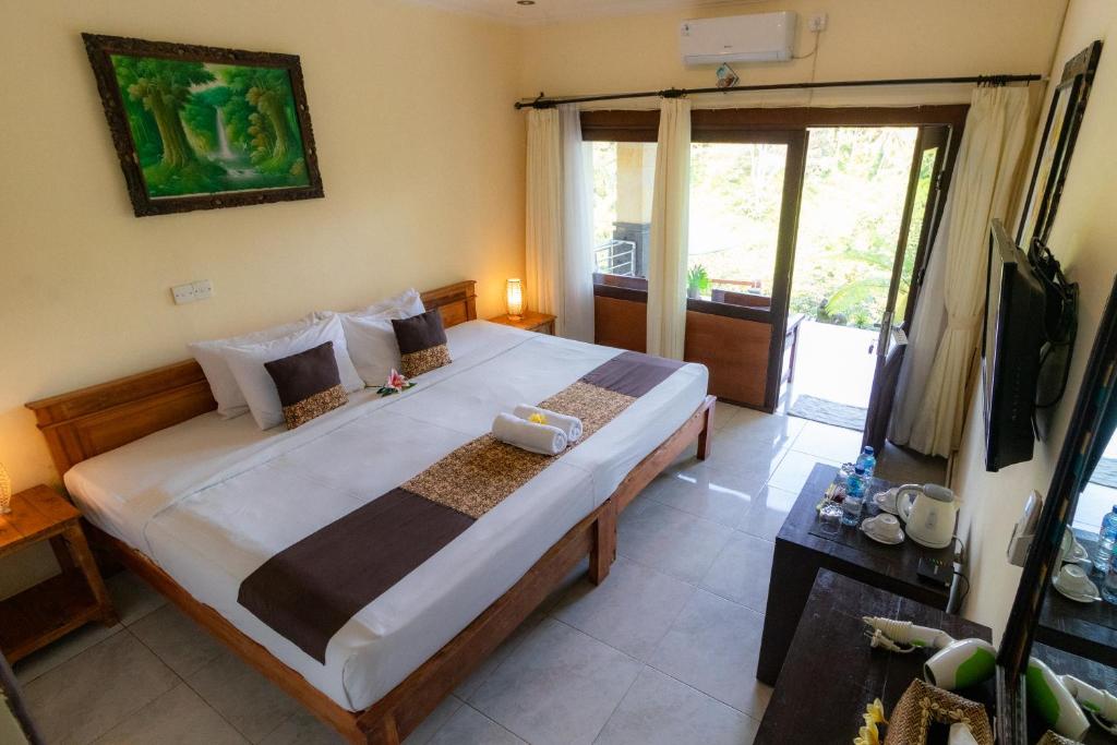 Postel nebo postele na pokoji v ubytování Doni House & Villas