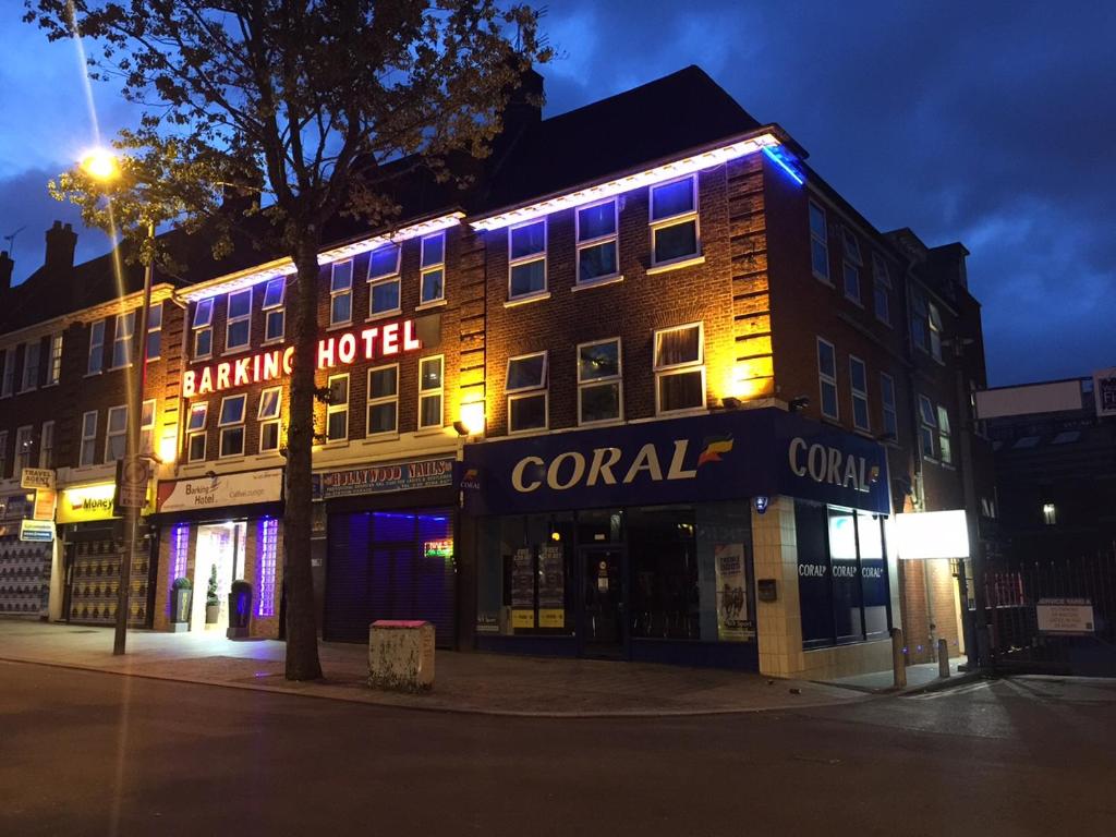 a building with blue lights on the side of it at Barking Hotel in Barking
