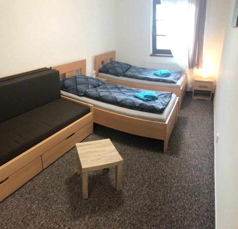 Postel nebo postele na pokoji v ubytování Park Penzion