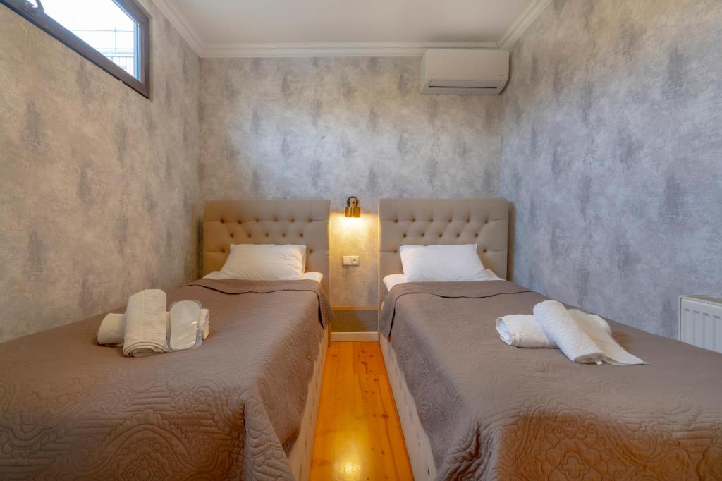 Postel nebo postele na pokoji v ubytování 4Season Villa