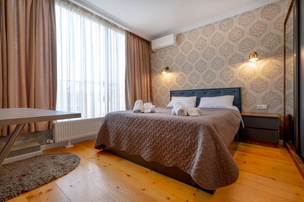 Postel nebo postele na pokoji v ubytování 4Season Villa