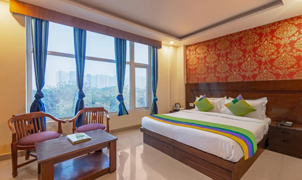 Katil atau katil-katil dalam bilik di Treebo Green View, Noida