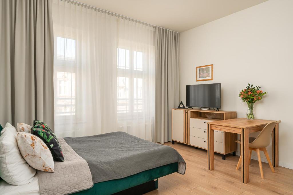 TV a/nebo společenská místnost v ubytování Chill4You Apartments