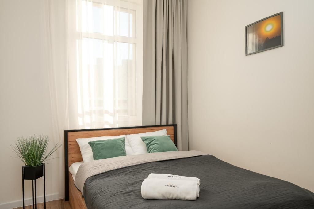 Postel nebo postele na pokoji v ubytování Chill4You Apartments