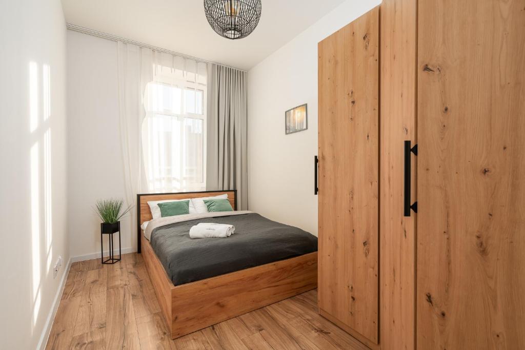 Postel nebo postele na pokoji v ubytování Chill4You Apartments