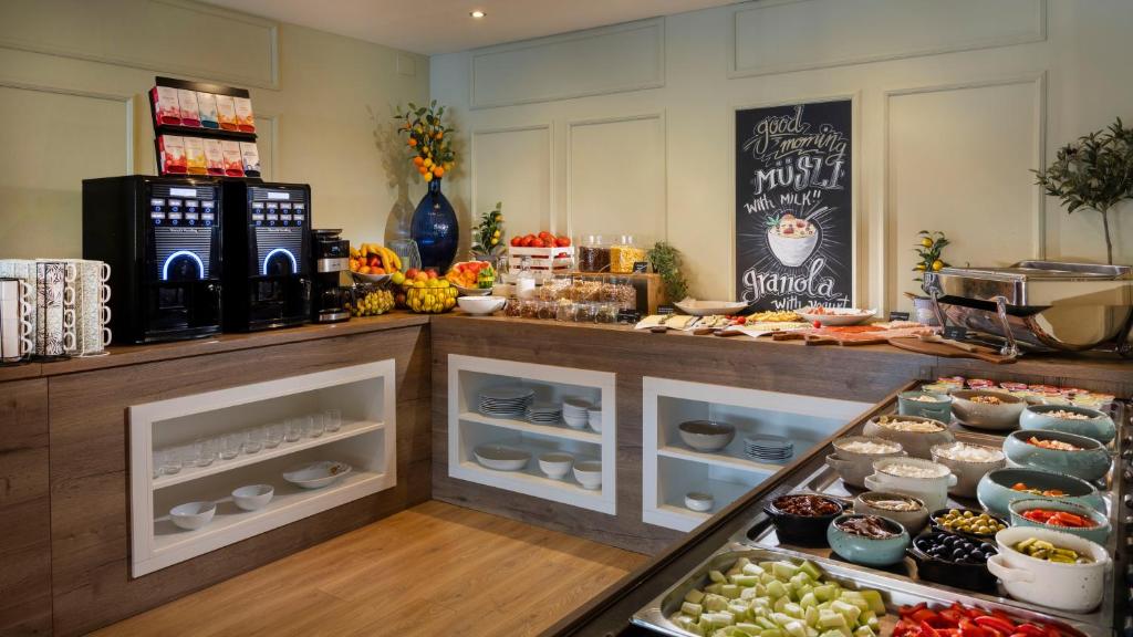a bakery with a counter with fruits and vegetables at Eola Leisure Rooms in Stara Baška