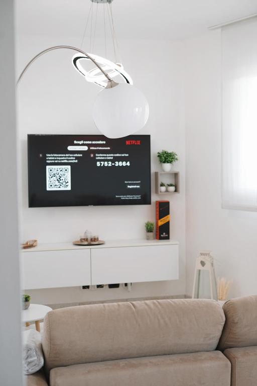 TV a/nebo společenská místnost v ubytování NSH Apart Malpensa