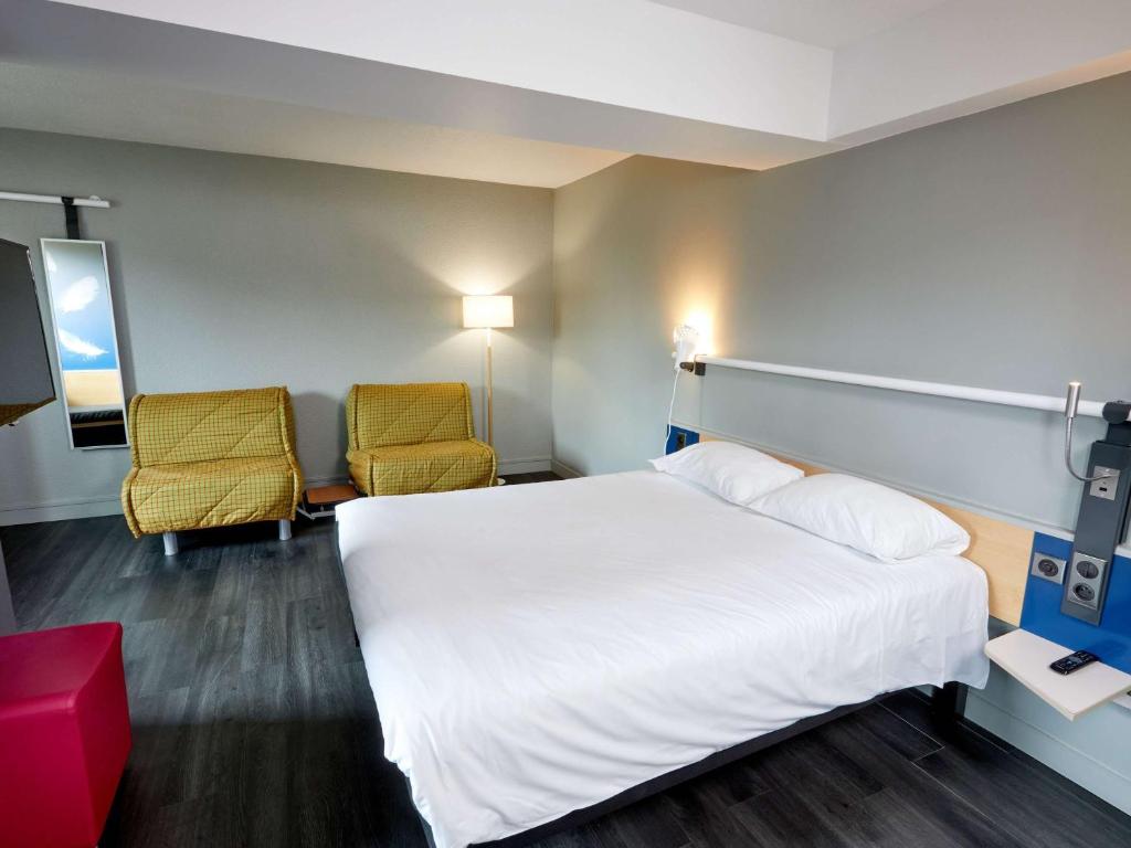 Postel nebo postele na pokoji v ubytování ibis Auxerre Sud