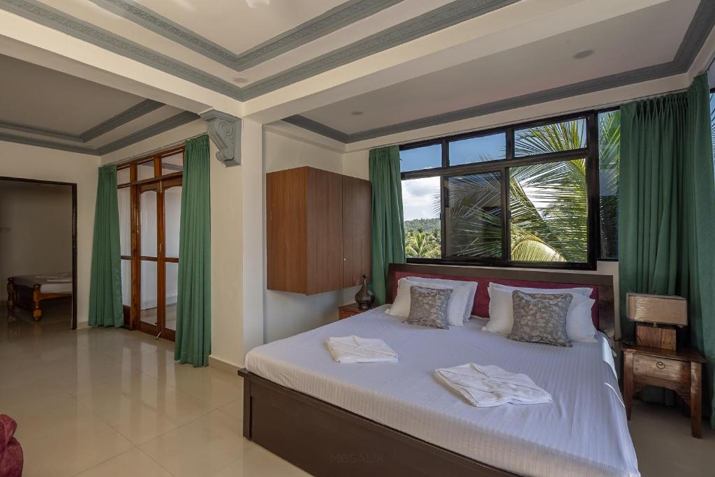 Postel nebo postele na pokoji v ubytování Broad Bean Royal Resort Goa
