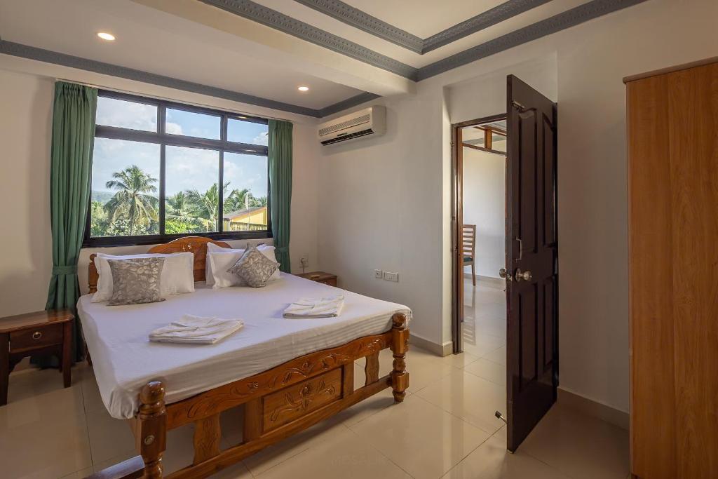 Postel nebo postele na pokoji v ubytování Broad Bean Royal Resort Goa
