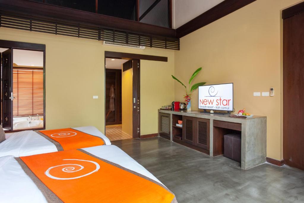 TV a/nebo společenská místnost v ubytování New Star Beach Resort