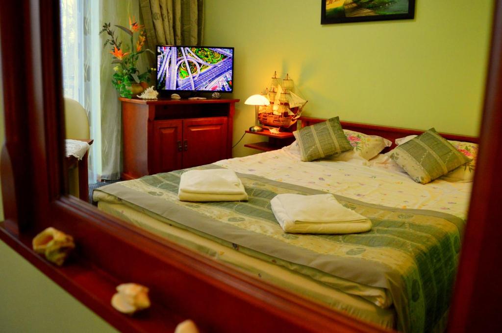 Postel nebo postele na pokoji v ubytování Hotel Spinaker